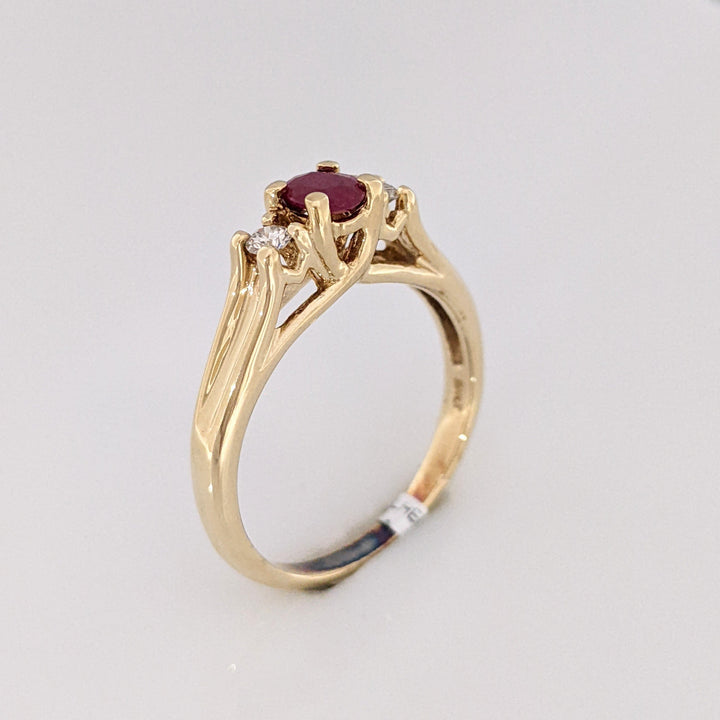 10K RUBY OVAL 4X6 "C" WITH .10 DIAMOND TOTAL WEIGHT (2) ESTATE RING 2.8 GRAMS