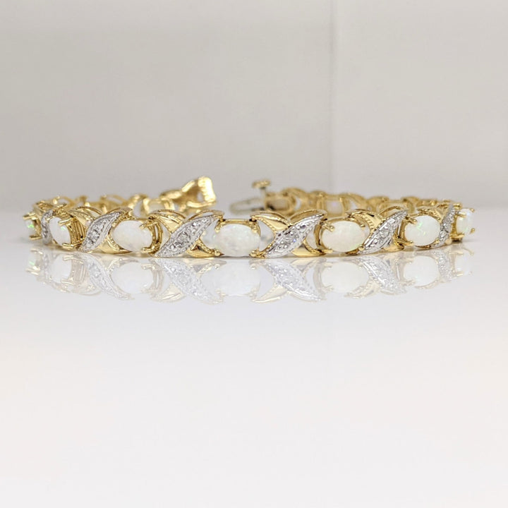 14K OPAL OVAL 4X6 (14) WITH (14) MELEE ESTATE BRACELET 8.7 GRAMS