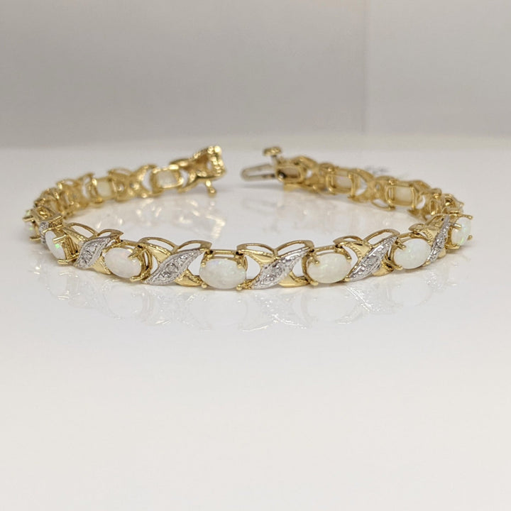 14K OPAL OVAL 4X6 (14) WITH (14) MELEE ESTATE BRACELET 8.7 GRAMS