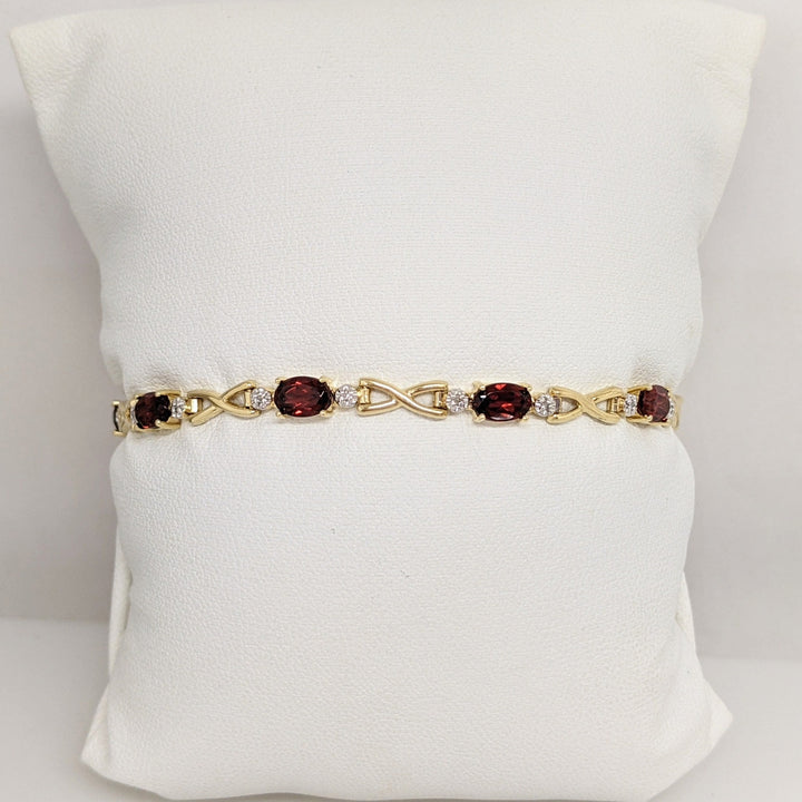 14K GARNET OVAL (9) 4X6 WITH MELEE ESTATE LINK BRACELET 6.2 GRAMS