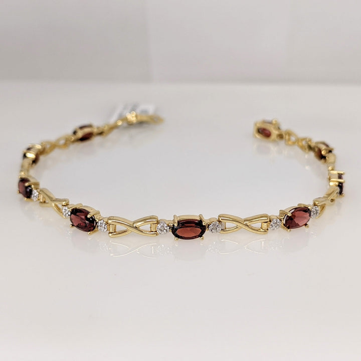 14K GARNET OVAL (9) 4X6 WITH MELEE ESTATE LINK BRACELET 6.2 GRAMS