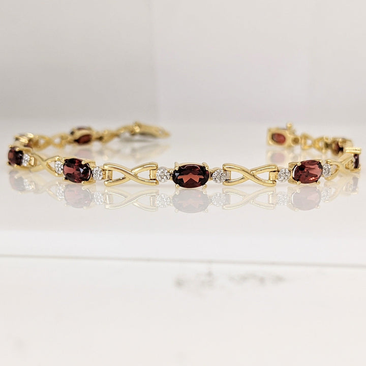 14K GARNET OVAL (9) 4X6 WITH MELEE ESTATE LINK BRACELET 6.2 GRAMS