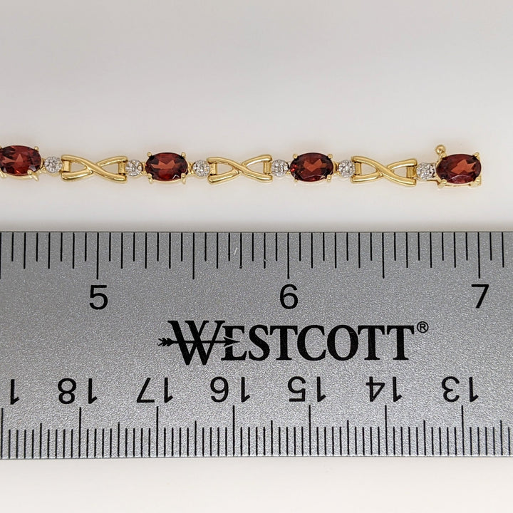 14K GARNET OVAL (9) 4X6 WITH MELEE ESTATE LINK BRACELET 6.2 GRAMS