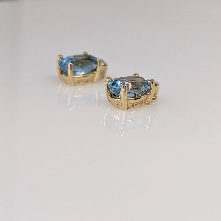 10K BLUE TOPAZ OVAL 5X7 WITH MELEE ESTATE EARRINGS 1.4 GRAMS