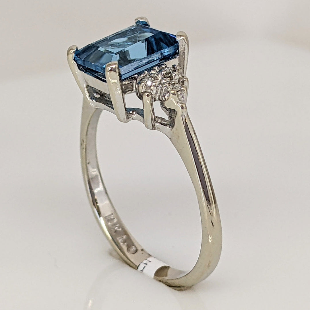 10K WHITE BLUE TOPAZ EMERALD CUT 6X8 WITH (6) MELEE ESTATE RING 2.6 GRAMS