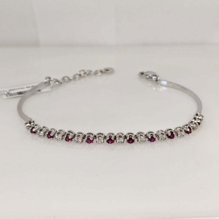 14K .51 CARAT TOTAL WEIGHT DIAMOND ROUND (11) .62 CARAT TOTAL WEIGHT RUBY ROUND (10) FLEXABLE ESTATE BRACELET 9.4 GRAMS