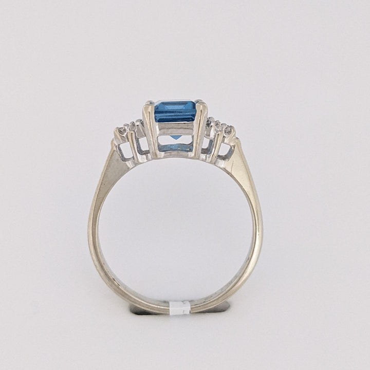 10K WHITE BLUE TOPAZ EMERALD CUT 6X8 WITH (6) MELEE ESTATE RING 2.6 GRAMS