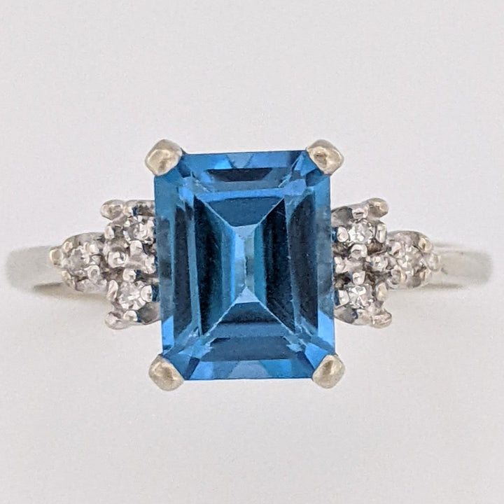 10K WHITE BLUE TOPAZ EMERALD CUT 6X8 WITH (6) MELEE ESTATE RING 2.6 GRAMS