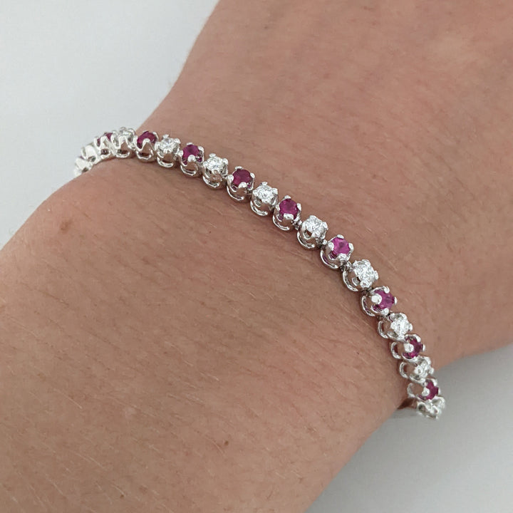 14K .51 CARAT TOTAL WEIGHT DIAMOND ROUND (11) .62 CARAT TOTAL WEIGHT RUBY ROUND (10) FLEXABLE ESTATE BRACELET 9.4 GRAMS
