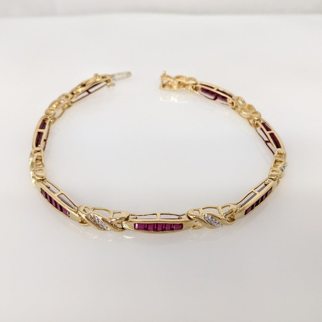 10K LAB-CREATED RUBY BAGUETTE (35) WITH (7) MELEE ESTATE BRACELET 9.1 GRAMS