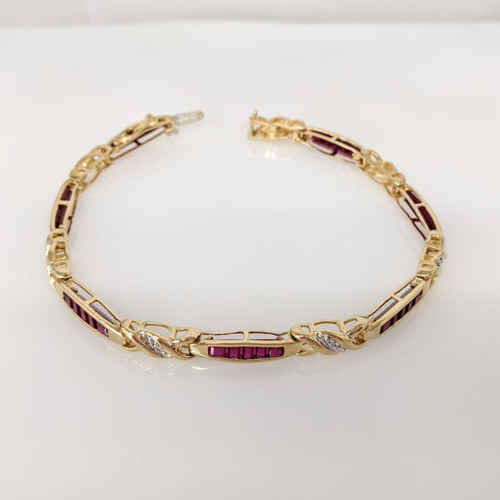 10K LAB-CREATED RUBY BAGUETTE (35) WITH (7) MELEE ESTATE BRACELET 9.1 GRAMS