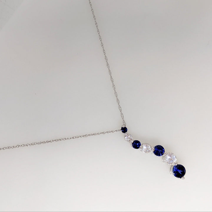 10K WHITE SYNTHETIC BLUE/ WHITE SAPPHIRE JOURNEY ESTATE PENDANT & CHAIN 1.8 GRAMS