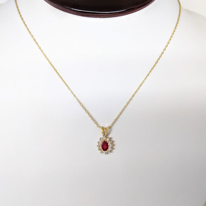 14K RUBY OVAL 4X6 WITH .25 DIAMOND TOTAL WEIGHT (12) ESTATE PENDANT & CHAIN 1.8 GRAMS