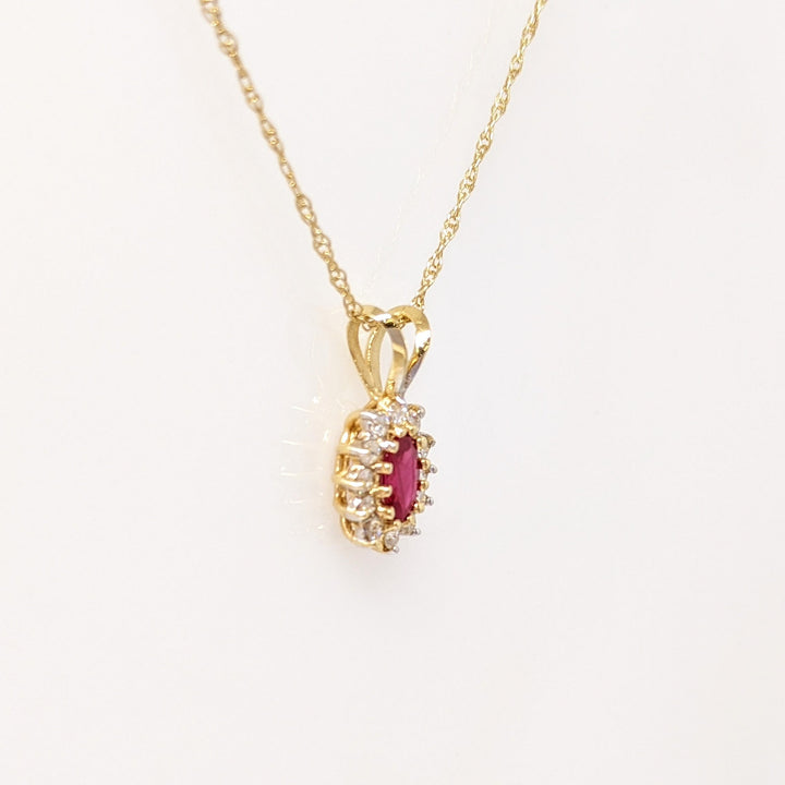 14K RUBY OVAL 4X6 WITH .25 DIAMOND TOTAL WEIGHT (12) ESTATE PENDANT & CHAIN 1.8 GRAMS
