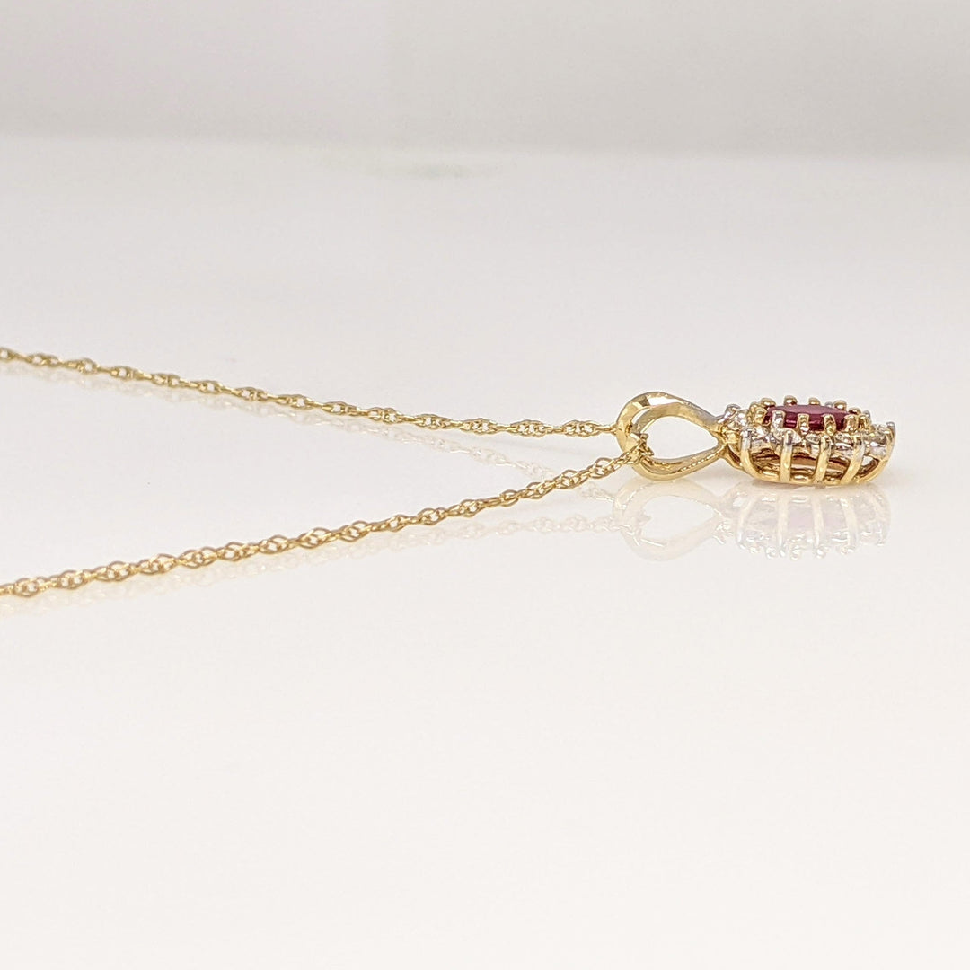 14K RUBY OVAL 4X6 WITH .25 DIAMOND TOTAL WEIGHT (12) ESTATE PENDANT & CHAIN 1.8 GRAMS
