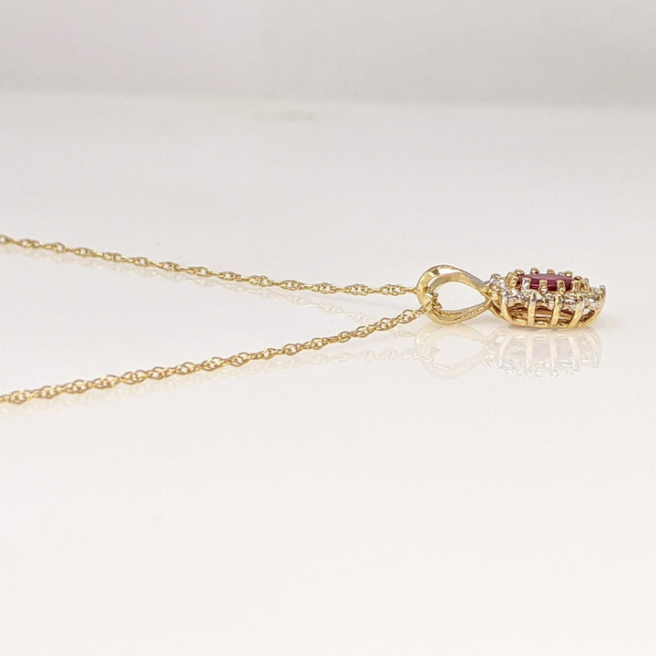 14K RUBY OVAL 4X6 WITH .25 DIAMOND TOTAL WEIGHT (12) ESTATE PENDANT & CHAIN 1.8 GRAMS