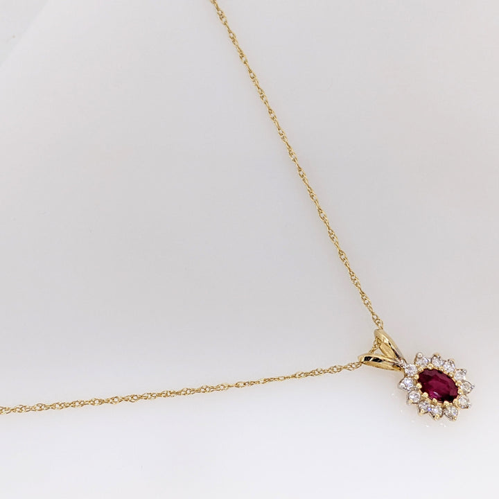 14K RUBY OVAL 4X6 WITH .25 DIAMOND TOTAL WEIGHT (12) ESTATE PENDANT & CHAIN 1.8 GRAMS