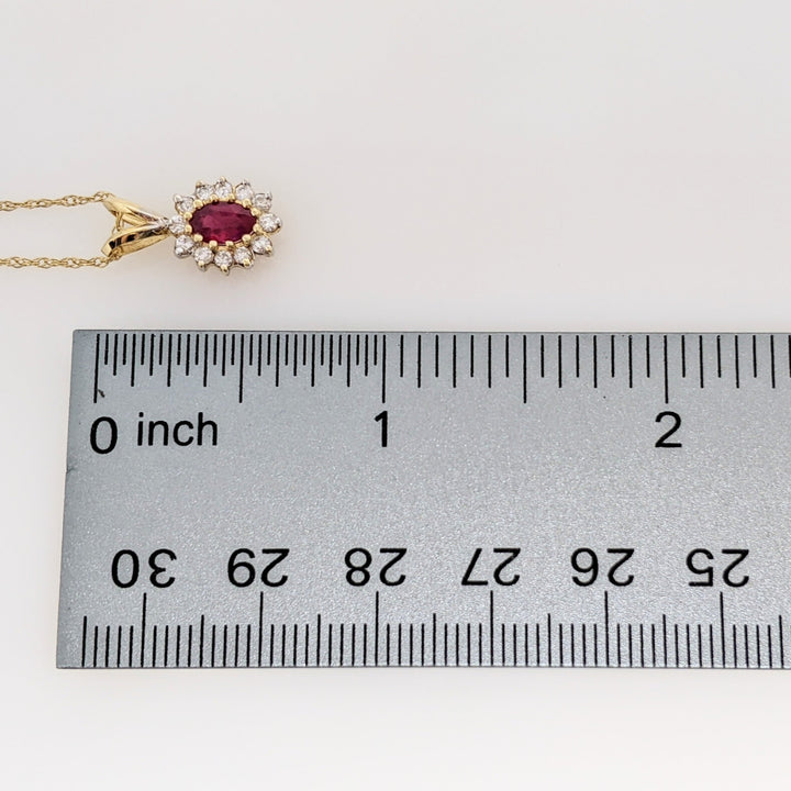 14K RUBY OVAL 4X6 WITH .25 DIAMOND TOTAL WEIGHT (12) ESTATE PENDANT & CHAIN 1.8 GRAMS