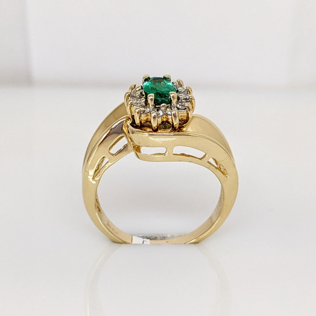 14K EMERALD OVAL  4X6 WITH .12 DIAMOND TOTAL WEIGHT (12) ROUND ESTATE RING 4.7 GRAMS