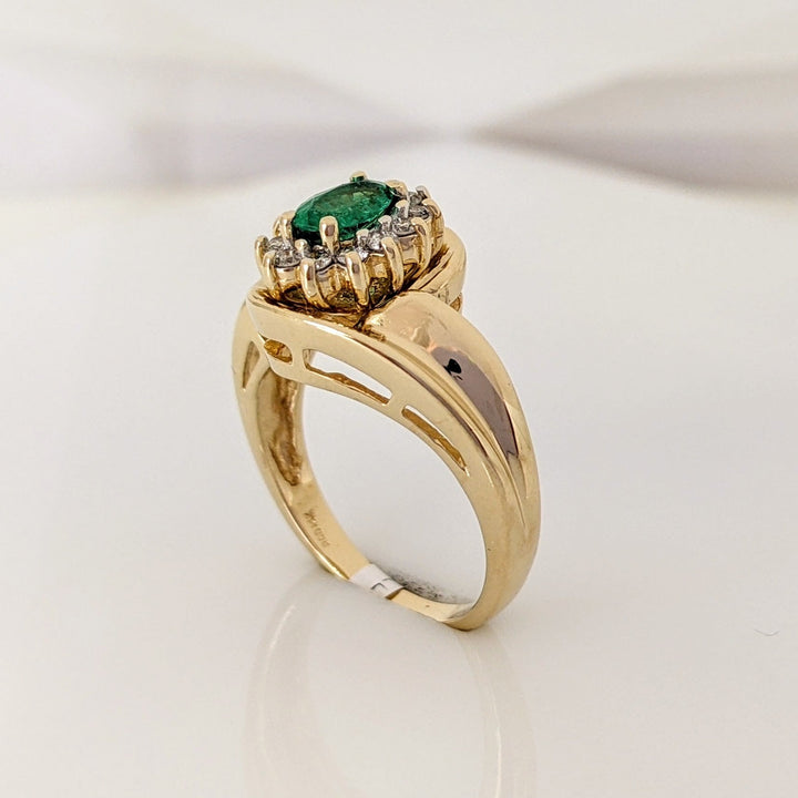14K EMERALD OVAL  4X6 WITH .12 DIAMOND TOTAL WEIGHT (12) ROUND ESTATE RING 4.7 GRAMS
