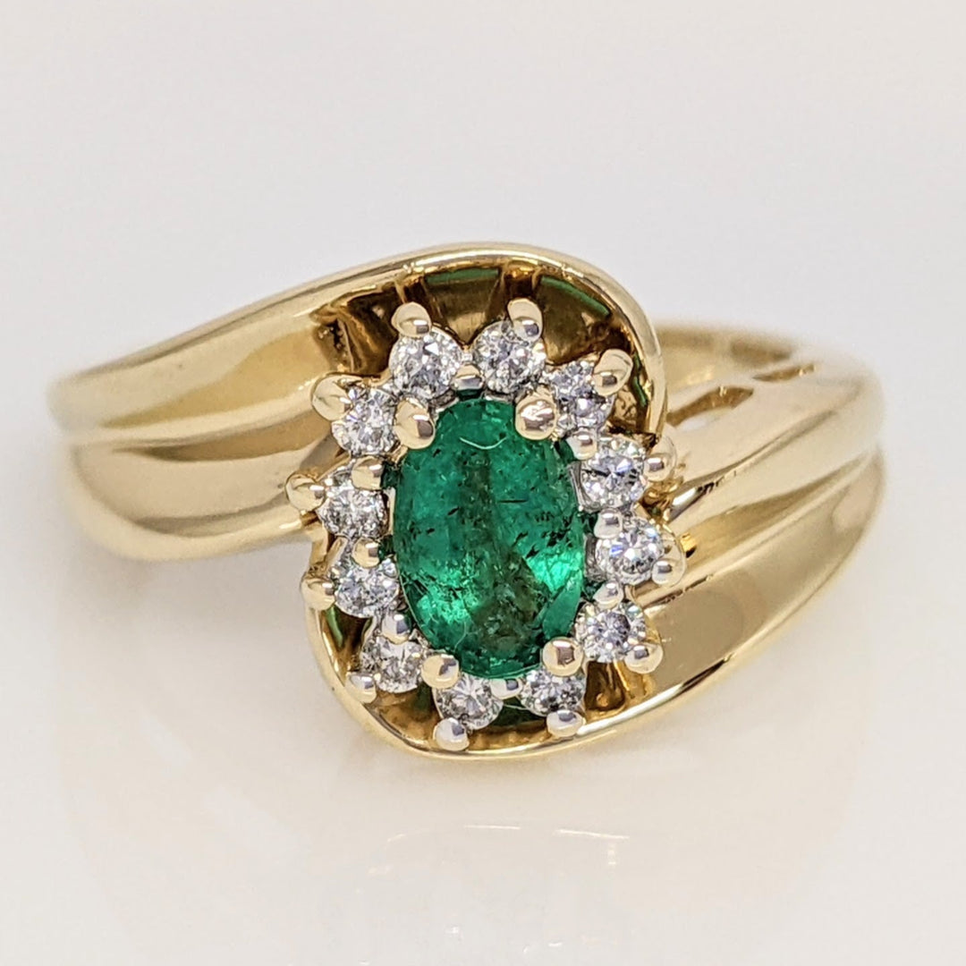 14K EMERALD OVAL  4X6 WITH .12 DIAMOND TOTAL WEIGHT (12) ROUND ESTATE RING 4.7 GRAMS