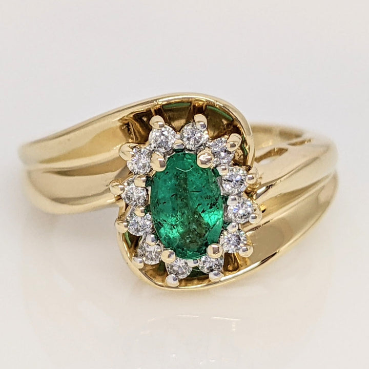 14K EMERALD OVAL  4X6 WITH .12 DIAMOND TOTAL WEIGHT (12) ROUND ESTATE RING 4.7 GRAMS