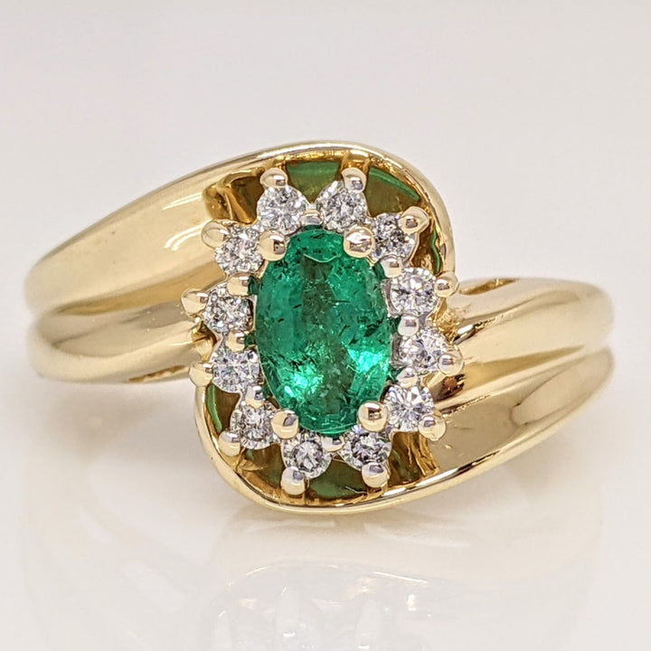 14K EMERALD OVAL  4X6 WITH .12 DIAMOND TOTAL WEIGHT (12) ROUND ESTATE RING 4.7 GRAMS