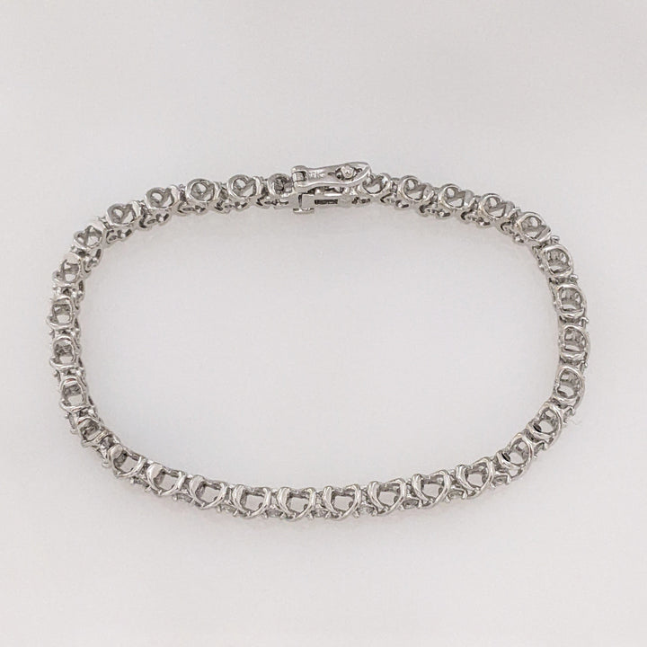14K WHITE 1.28 CARAT TOTAL WEIGHT I1 I DIAMOND ROUND (32) "X" LINK ESTATE BRACELET 15.1 GRAMS