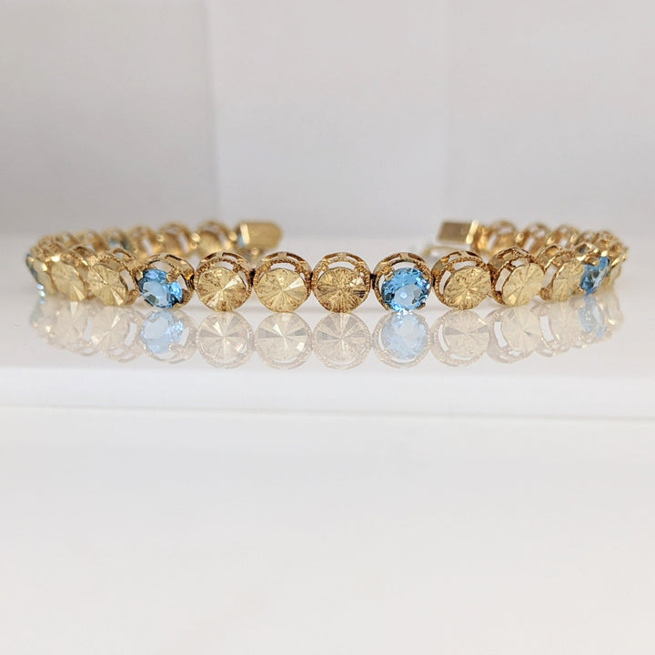 14K BLUE TOPAZ ROUND (7) 5MM TENNIS ESTATE BRACELET 10.4 GRAMS