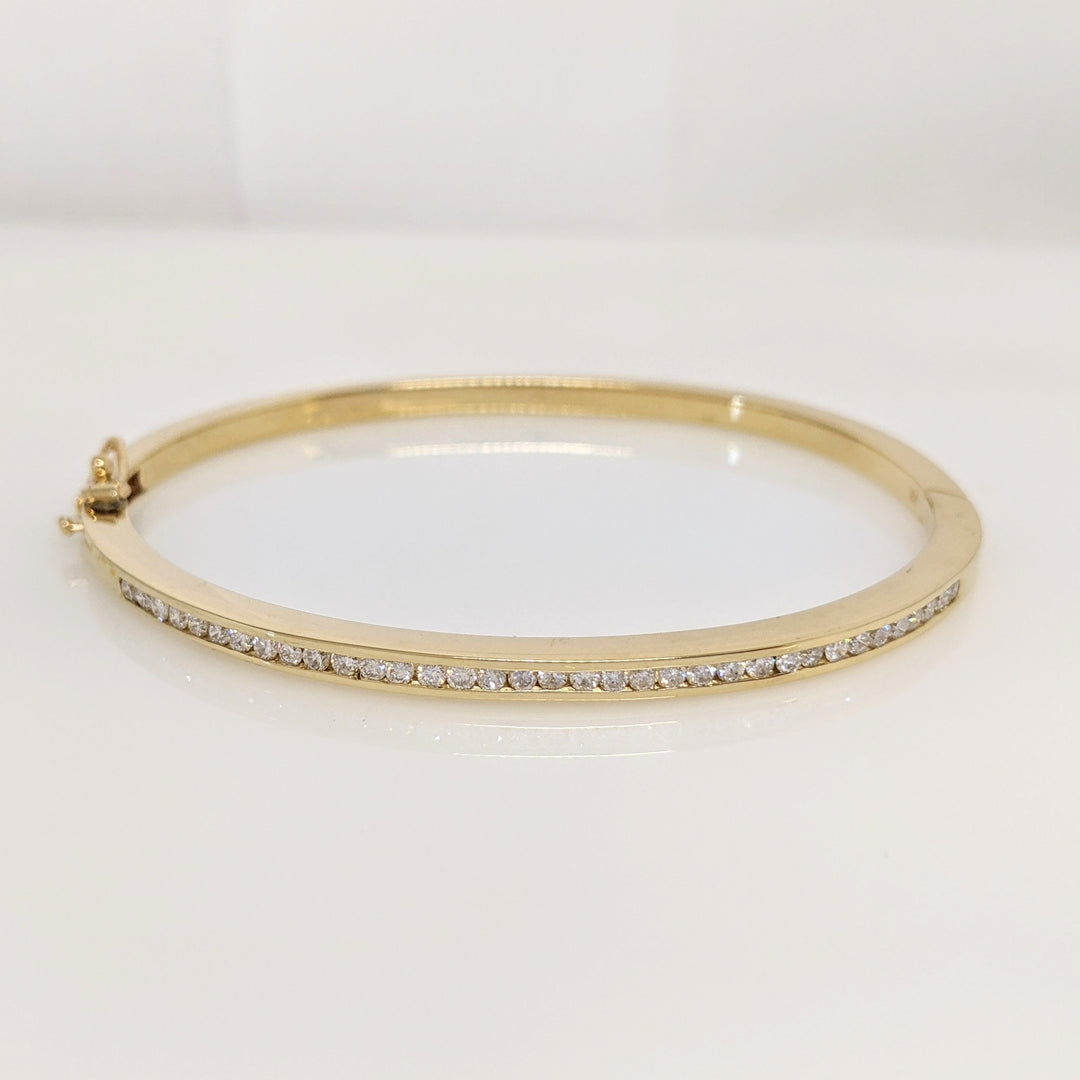 14K .70 CARAT TOTAL WEIGHT I1 I DIAMOND ROUND (35) CHANNEL SET ESTATE BANGLE 15.8 GRAMS