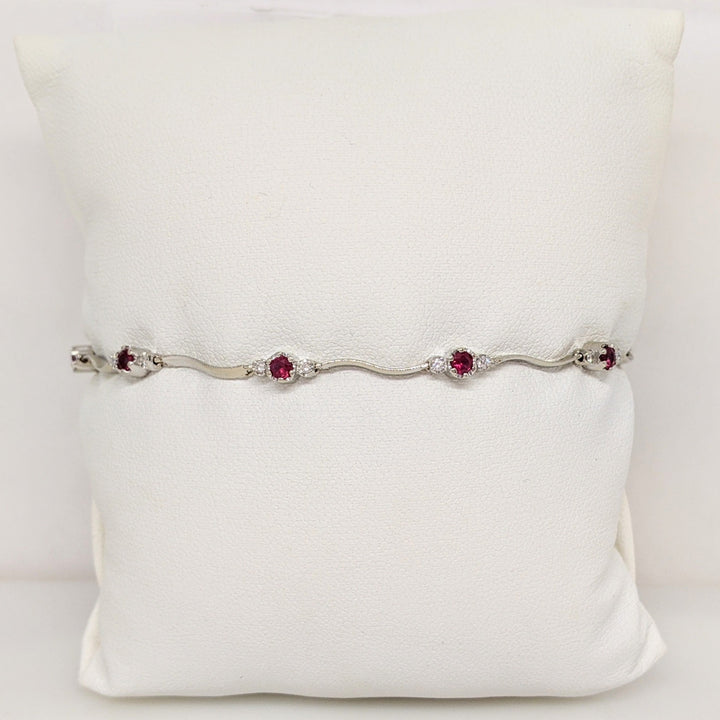 14K WHITE RUBY ROUND (8) 3MM WITH .16 DIAMOND TOTAL WEIGHT (16) ESTATE WAVY BRACELET 4.3 GRAMS