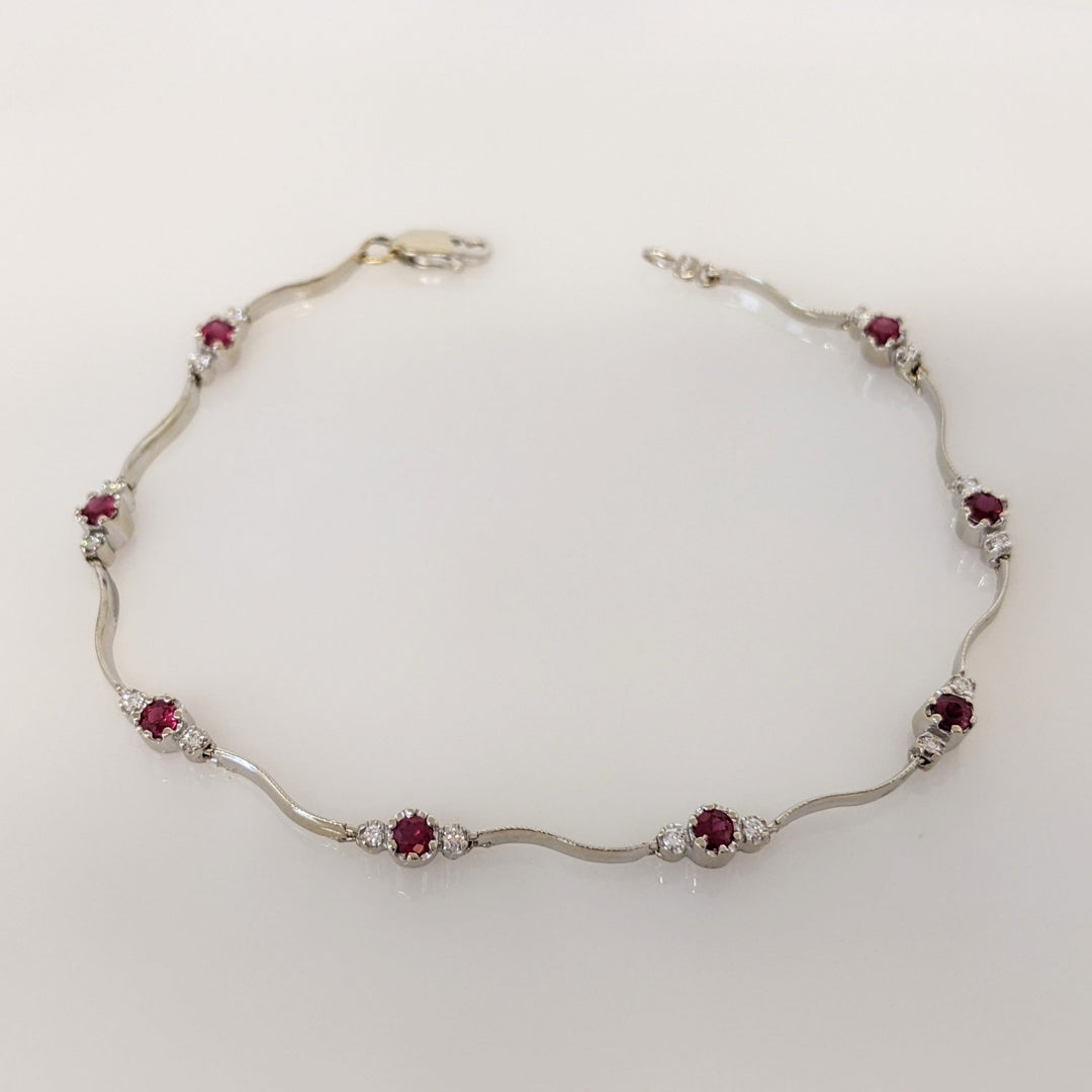 14K WHITE RUBY ROUND (8) 3MM WITH .16 DIAMOND TOTAL WEIGHT (16) ESTATE WAVY BRACELET 4.3 GRAMS