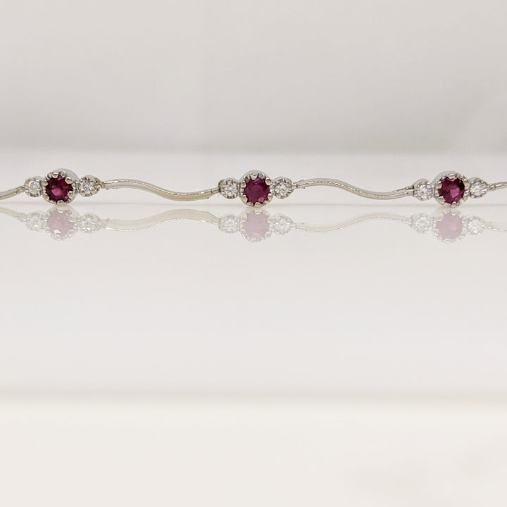 14K WHITE RUBY ROUND (8) 3MM WITH .16 DIAMOND TOTAL WEIGHT (16) ESTATE WAVY BRACELET 4.3 GRAMS