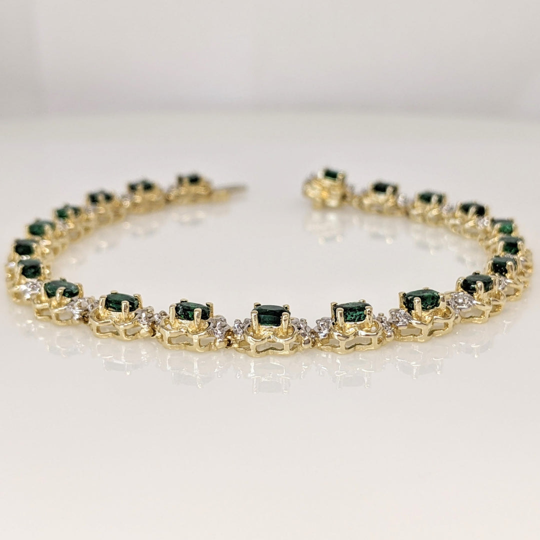 14K EMERALD OVAL 3X4 (21) WITH .50 DIAMOND TOTAL WEIGHT (42) ROUND ESTATE BRACELET 10.8 GRAMS