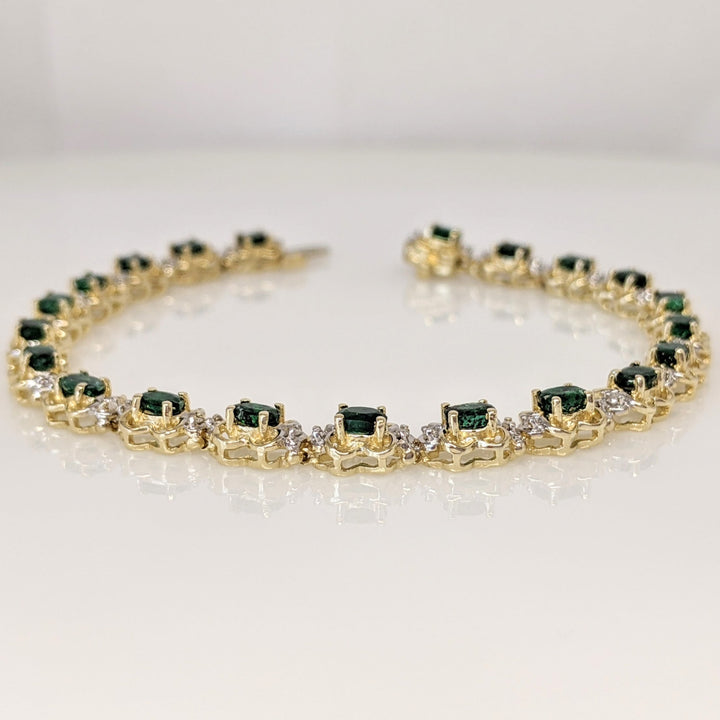 14K EMERALD OVAL 3X4 (21) WITH .50 DIAMOND TOTAL WEIGHT (42) ROUND ESTATE BRACELET 10.8 GRAMS