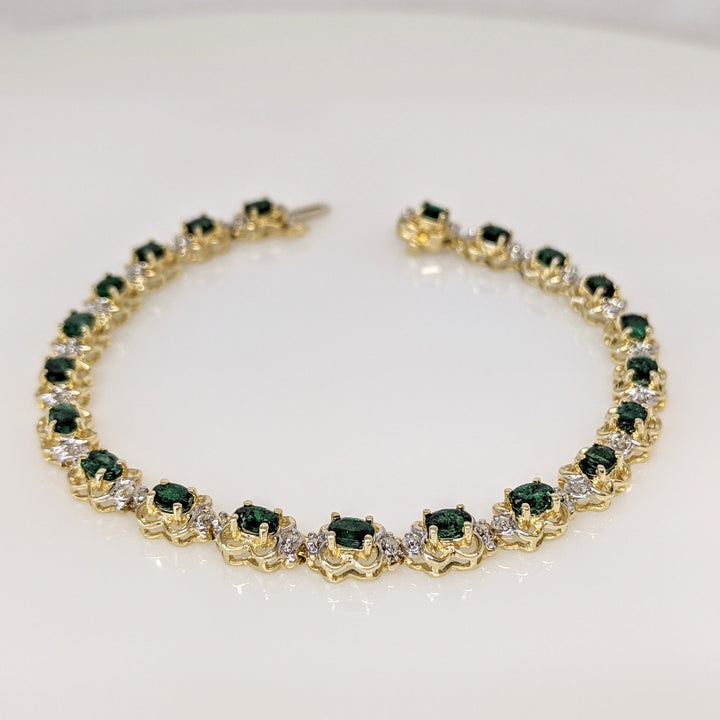 14K EMERALD OVAL 3X4 (21) WITH .50 DIAMOND TOTAL WEIGHT (42) ROUND ESTATE BRACELET 10.8 GRAMS