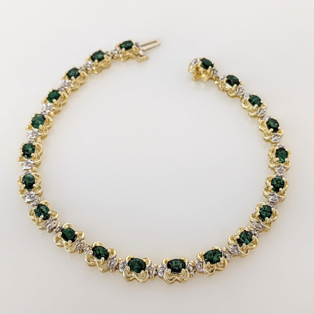 14K EMERALD OVAL 3X4 (21) WITH .50 DIAMOND TOTAL WEIGHT (42) ROUND ESTATE BRACELET 10.8 GRAMS