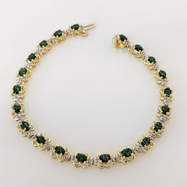14K EMERALD OVAL 3X4 (21) WITH .50 DIAMOND TOTAL WEIGHT (42) ROUND ESTATE BRACELET 10.8 GRAMS
