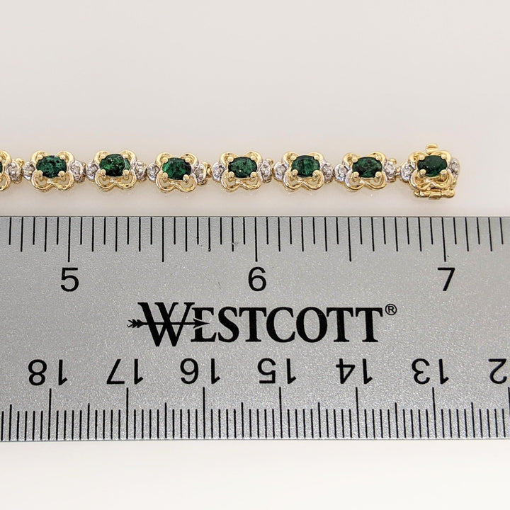 14K EMERALD OVAL 3X4 (21) WITH .50 DIAMOND TOTAL WEIGHT (42) ROUND ESTATE BRACELET 10.8 GRAMS