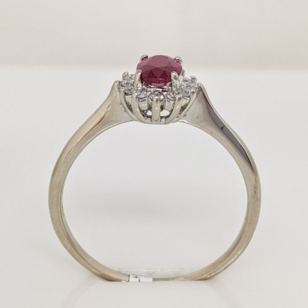 14K WHITE CLARITY ENHANCED RUBY OVAL 4X6 WITH .12 DIAMOND TOTAL WEIGHT ESTATE RING 2.1 GRAMS