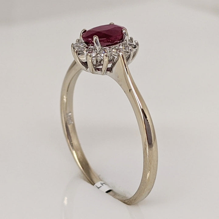 14K WHITE CLARITY ENHANCED RUBY OVAL 4X6 WITH .12 DIAMOND TOTAL WEIGHT ESTATE RING 2.1 GRAMS