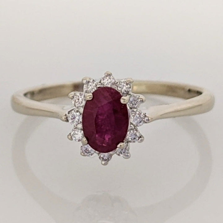 14K WHITE CLARITY ENHANCED RUBY OVAL 4X6 WITH .12 DIAMOND TOTAL WEIGHT ESTATE RING 2.1 GRAMS