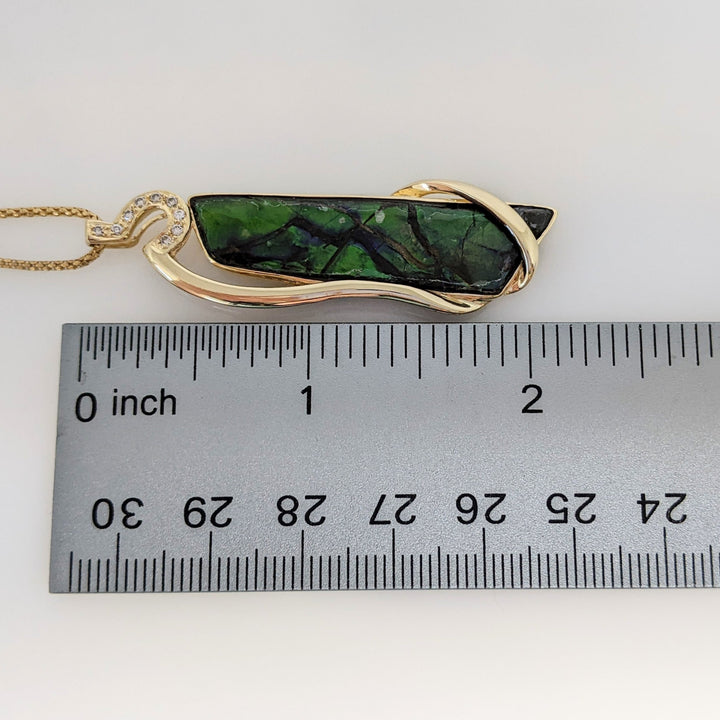 14K AMMOLITE FREE FORM 10X42 WITH (9) MELEE ESTATE PENDANT & CHAIN 9.9 GRAMS