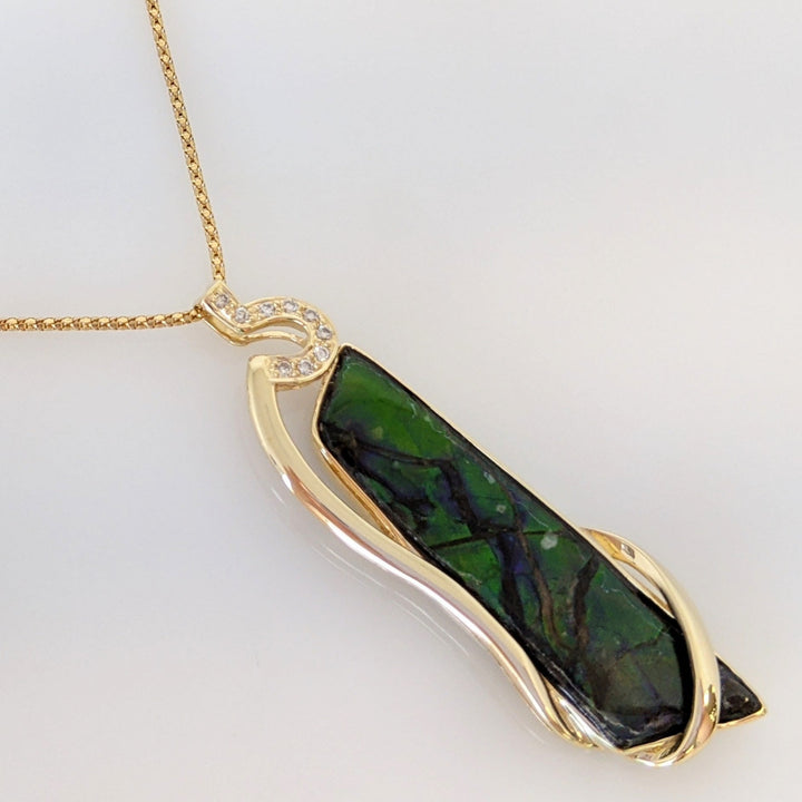 14K AMMOLITE FREE FORM 10X42 WITH (9) MELEE ESTATE PENDANT & CHAIN 9.9 GRAMS
