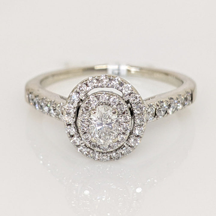 14K WHITE .59 CARAT TOTAL WEIGHT I1 H DIAMOND OVAL (1) ROUND (45) ESTATE HALO RING 2.9 GRAMS