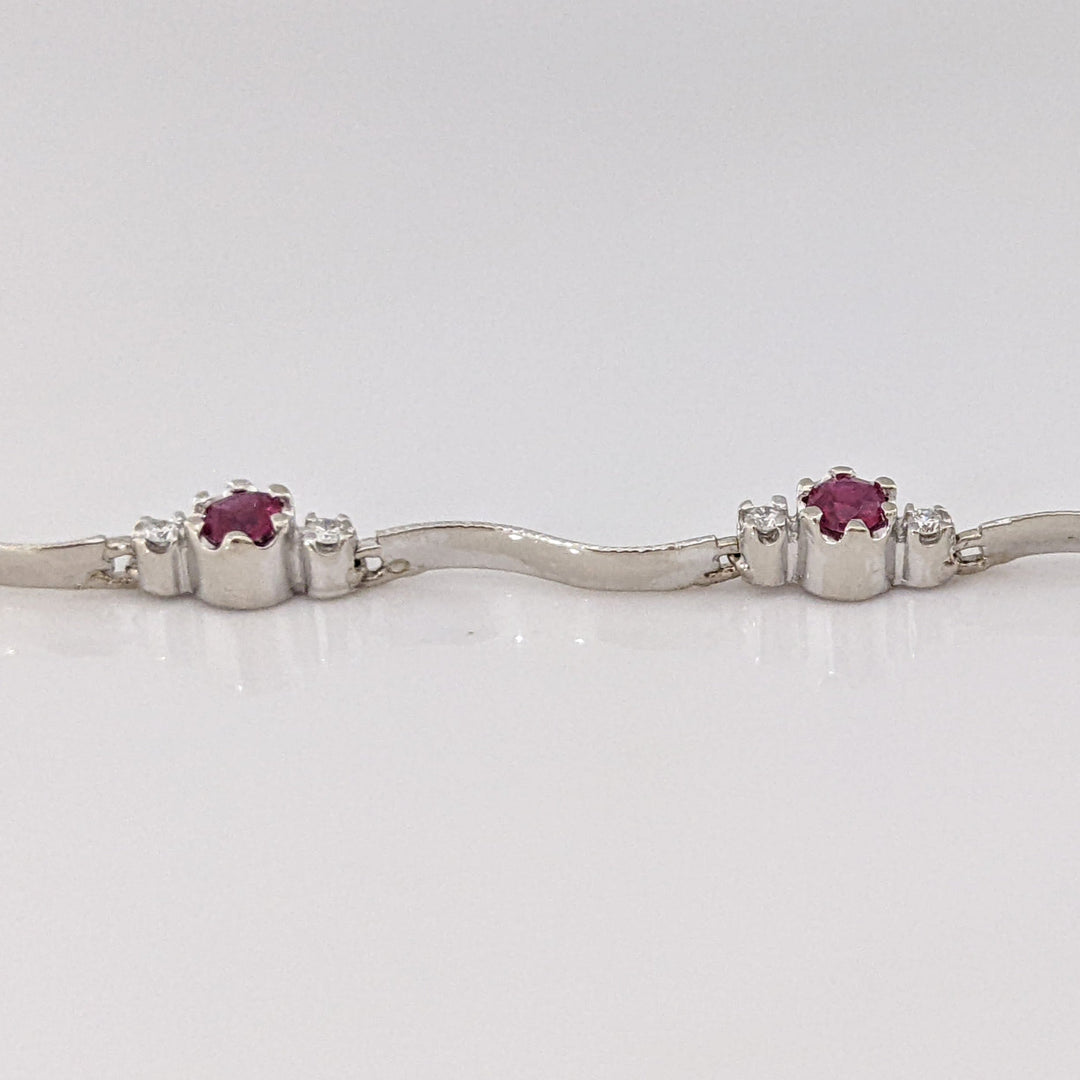 14K WHITE RUBY ROUND (8) 3MM WITH .16 DIAMOND TOTAL WEIGHT (16) ESTATE WAVY BRACELET 4.3 GRAMS