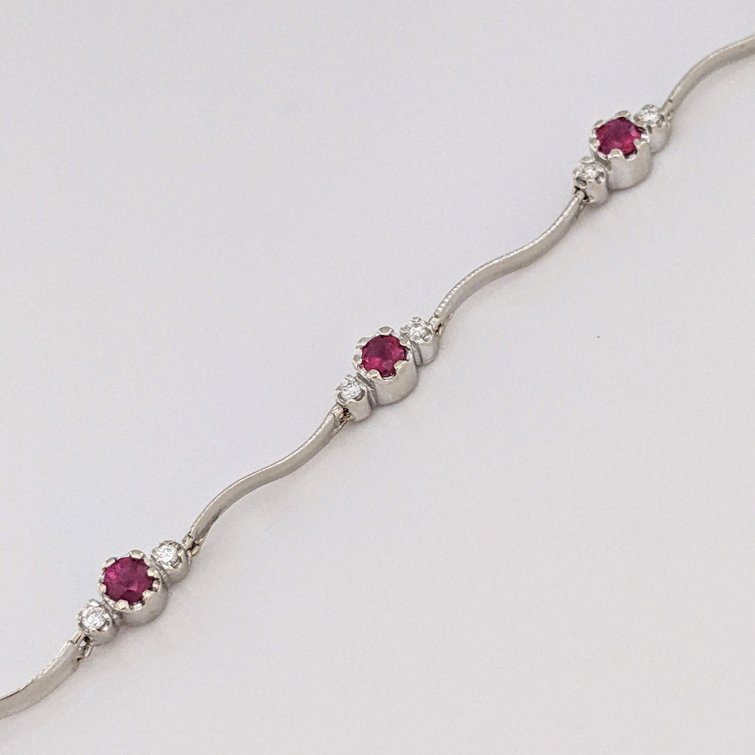 14K WHITE RUBY ROUND (8) 3MM WITH .16 DIAMOND TOTAL WEIGHT (16) ESTATE WAVY BRACELET 4.3 GRAMS