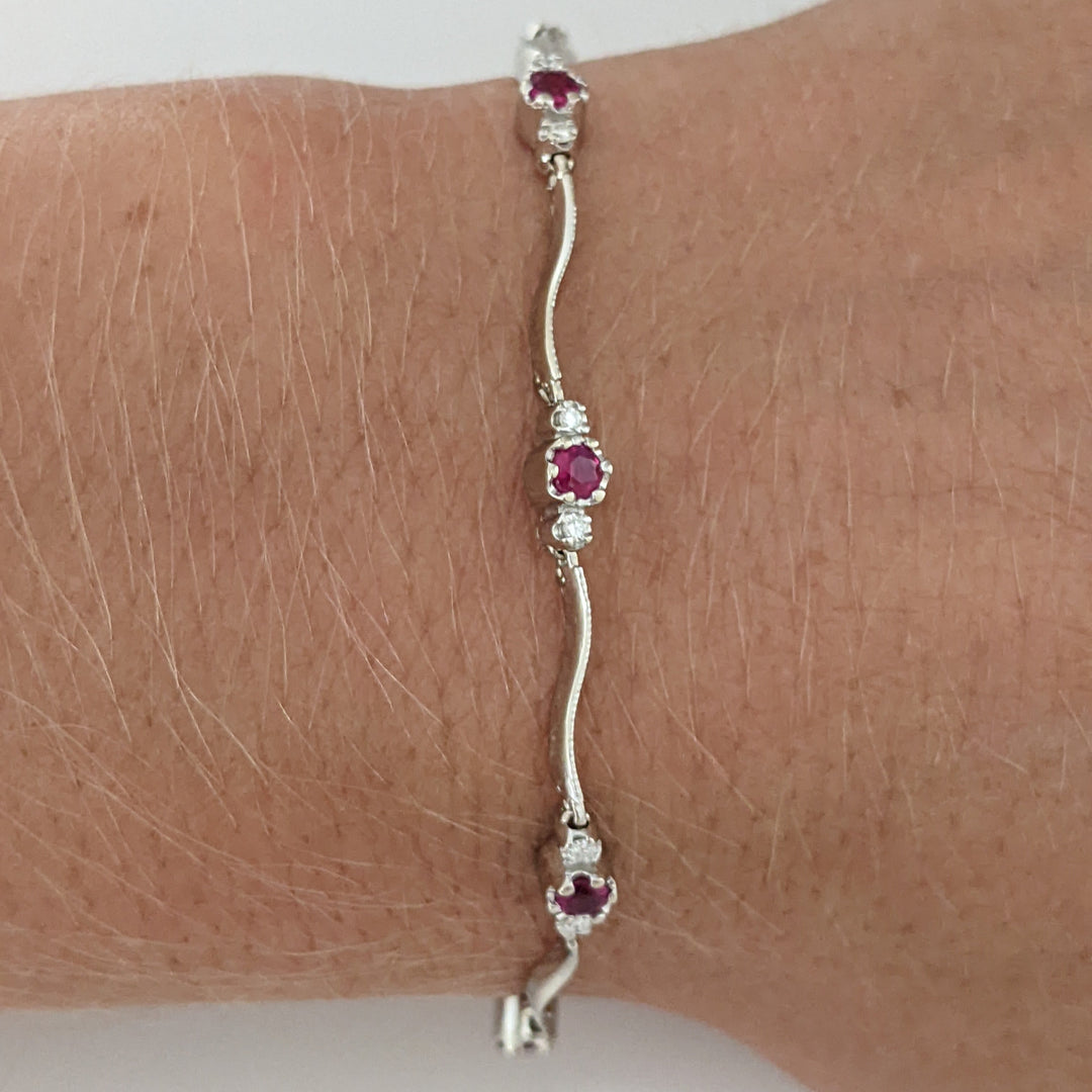 14K WHITE RUBY ROUND (8) 3MM WITH .16 DIAMOND TOTAL WEIGHT (16) ESTATE WAVY BRACELET 4.3 GRAMS