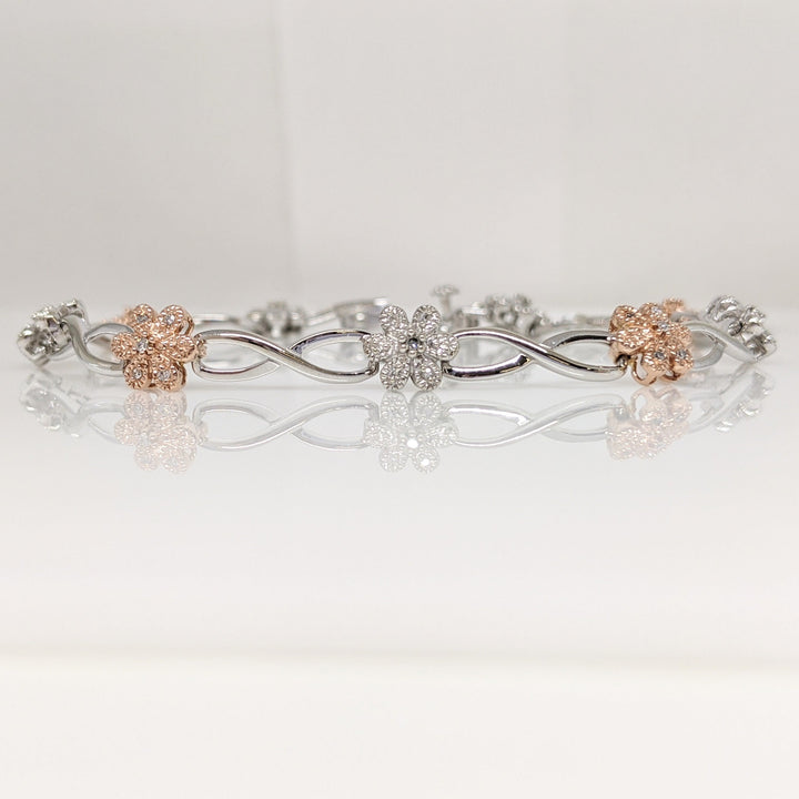 10K TWO-TONE 1.00 CARAT TOTAL WEIGHT DIAMOND ROUND PROMOTIONAL FLORAL LINK ESTATE BRACELET 8.6 GRAMS