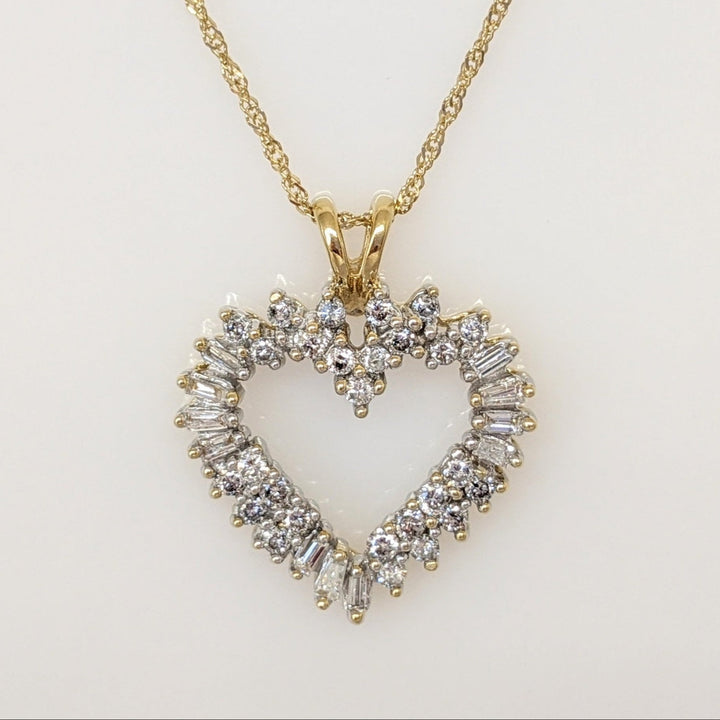 14K .76 CARAT TOTAL WEIGHT I1 H DIAMOND ROUND (27) BAGUETTE (11) ESTATE HEART PENDANT & CHAIN 4.4 GRAMS